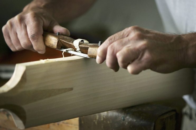 Business professionals discussing strategy in a modern office setting, emphasizing teamwork and collaboration in a corpora...