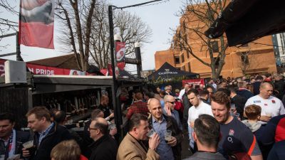 GettyImages 652057850 showing a business meeting with diverse professionals engaged in discussion around a table in a mode...
