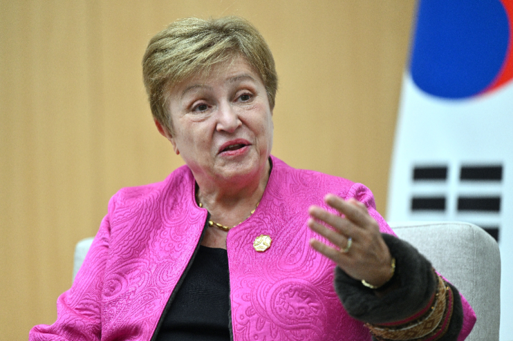 IMF Managing Director Kristalina Georgieva speaking at a press conference, addressing global economic challenges.