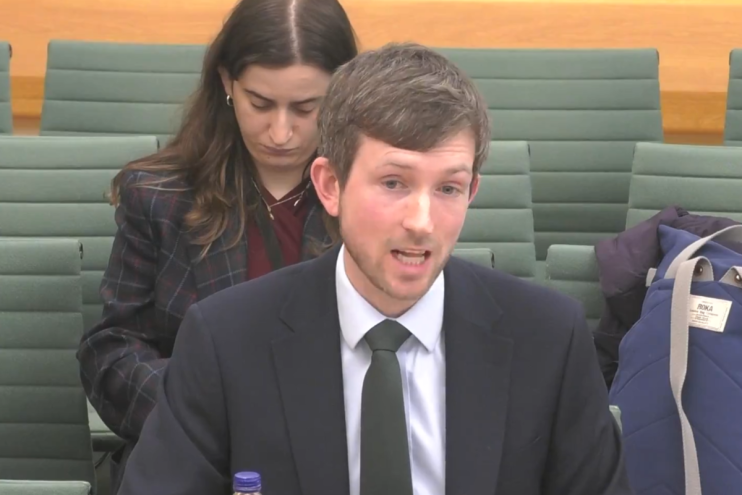 Treasury Minister Dan Tomlinson at a press conference discussing economic policies and financial strategies.