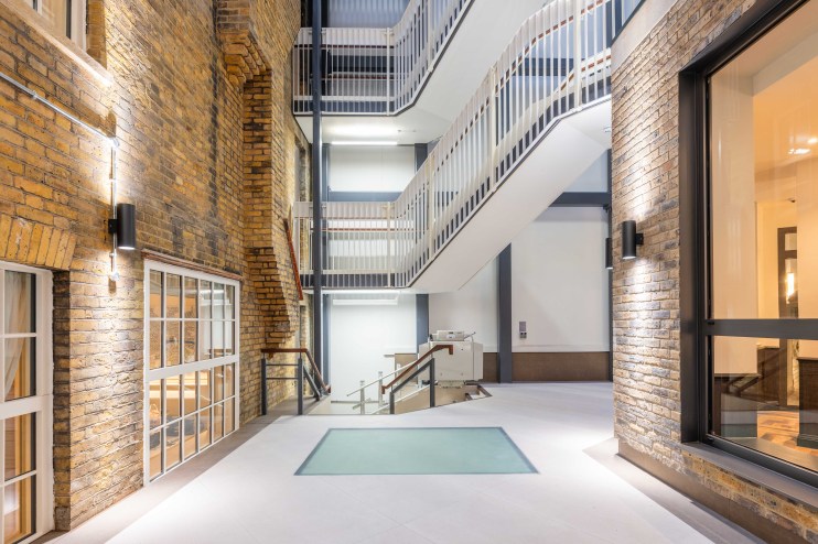 Premier Inn London Farringdon Old Bailey lobby designed by Chris Dalton, showcasing modern decor and welcoming atmosphere