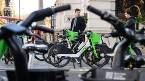 Lime e-bikes lined up in London, showcasing sustainable urban transport solutions in a bustling city environment