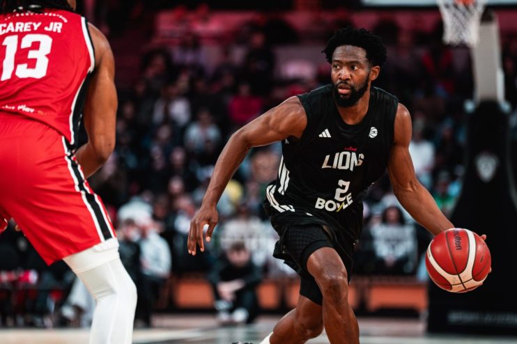 Lions vs Riders SLB2 game action, players in motion on the field, capturing intensity and excitement of the match