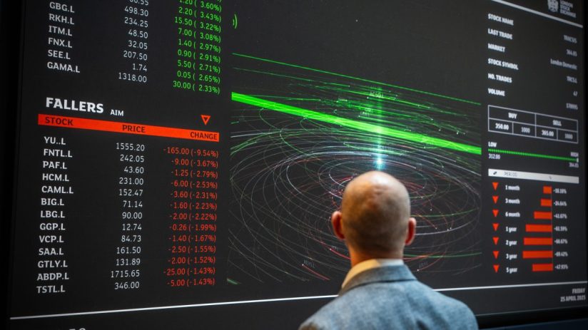 London Stock Exchange digital tickers displaying real-time stock prices and market updates in a bustling financial setting