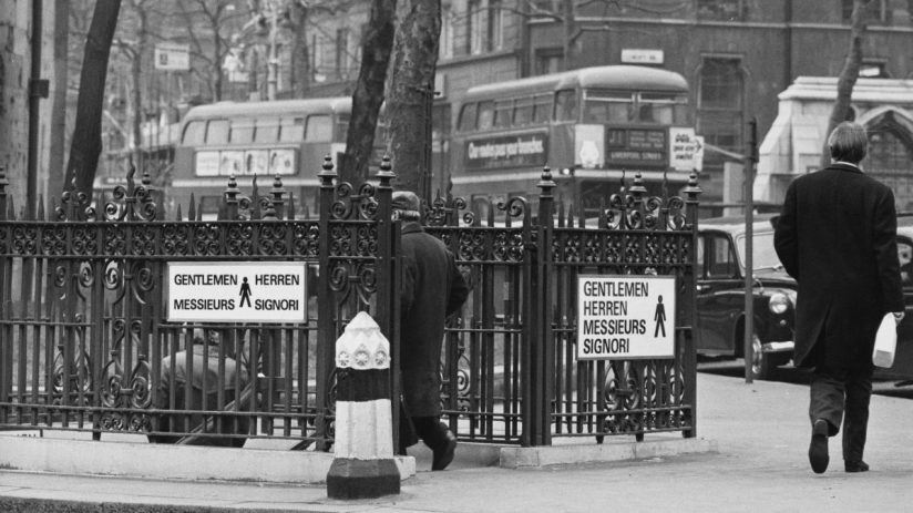 1973 London public toilet exterior, showcasing vintage design and architecture in a historical urban setting
