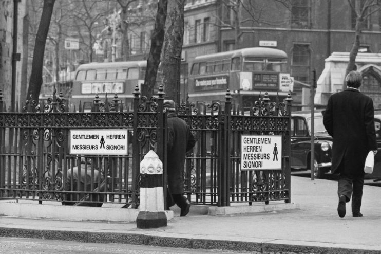 1973 London public toilet exterior, showcasing vintage design and architecture in a historical urban setting
