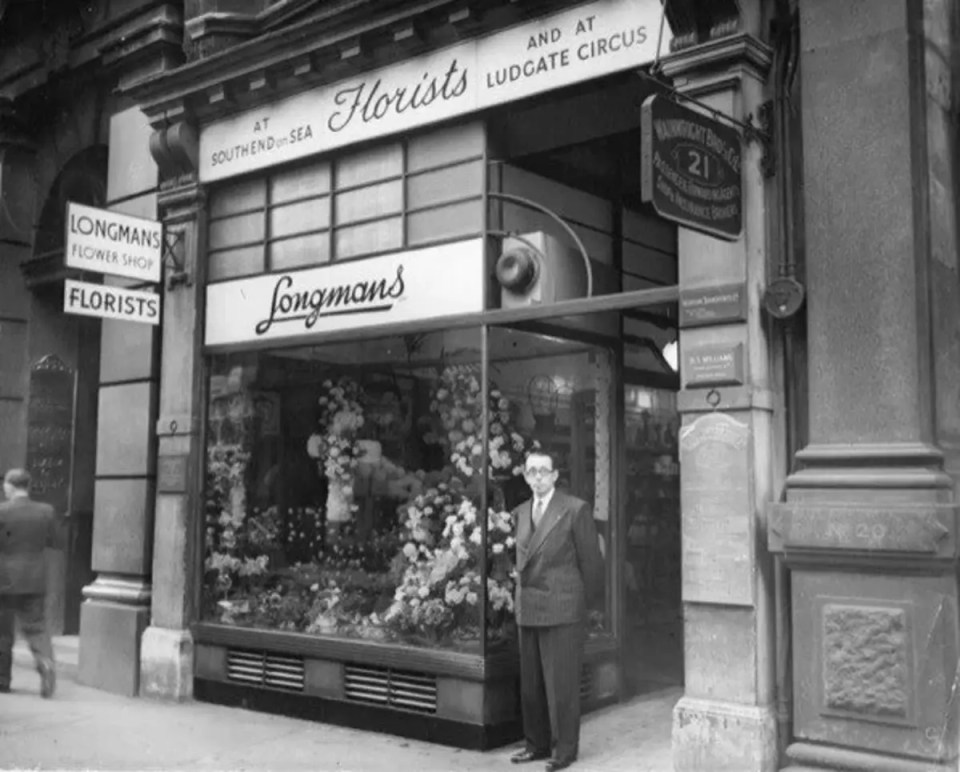 Longman2 business meeting with professionals discussing strategy in a modern conference room setting.