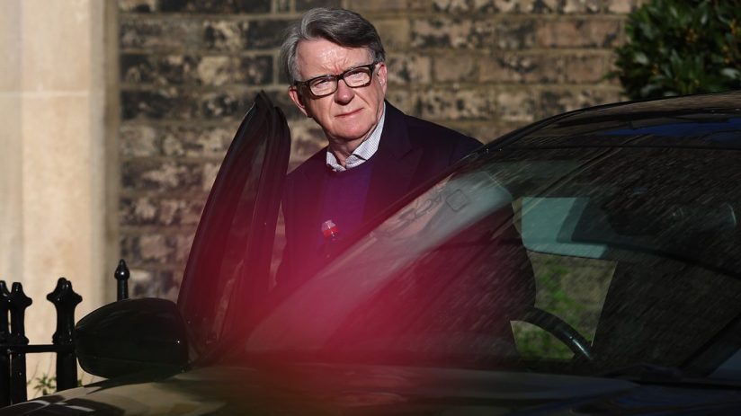 Lord Mandelson giving a speech at a business conference, addressing economic policies and industry challenges.