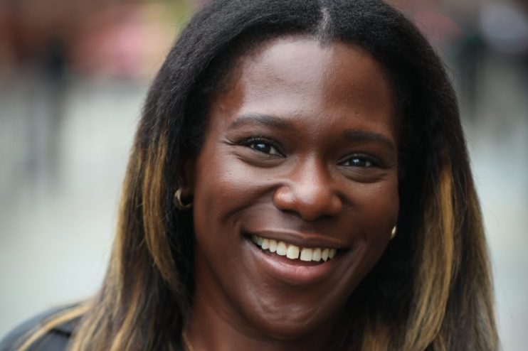 Professional headshot of a person named Newton, suitable for business or news publication, with a neutral background.
