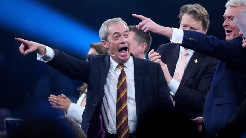Nigel Farage speaking at Reform UK rally in Birmingham, February 2026, addressing supporters in a crowded venue