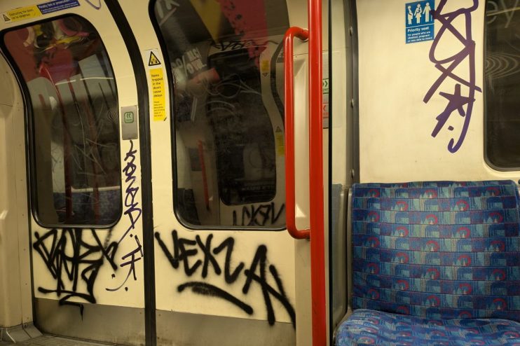 Skyline view of downtown city buildings under clear blue skies on a calm day, highlighting urban architecture and vibrant ...