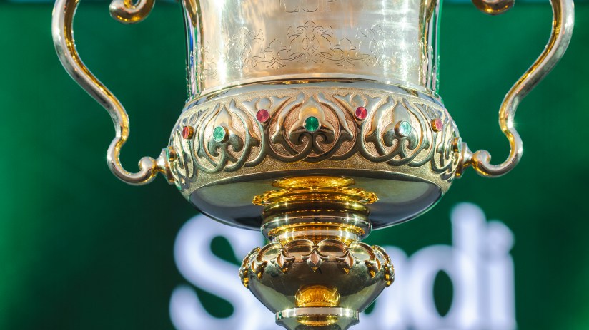 Saudi Cup trophy on display, shining gold with intricate detailing, representing prestigious horse racing event in Riyadh.