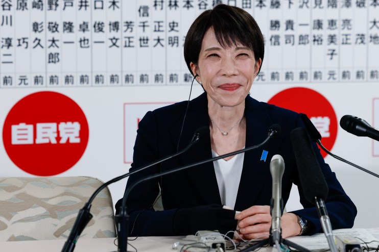 Sanae Takaichi speaking at a press conference, addressing recent political developments in Japans government policies