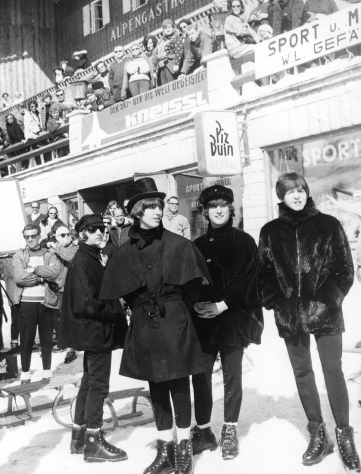 The Beatles filming Help! in snowy Obertauern, Austria, showcasing iconic 1960s fashion amidst a winter backdrop.