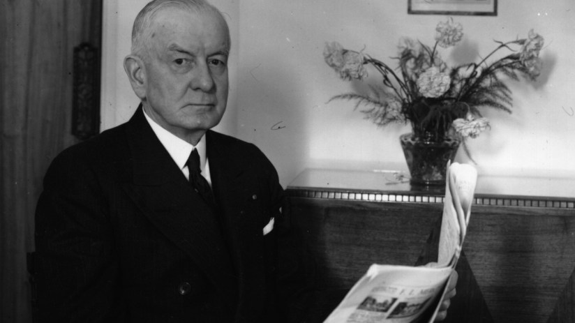 Thomas Watson, former IBM CEO, in a business setting, highlighting his leadership era at IBM in the mid-20th century.