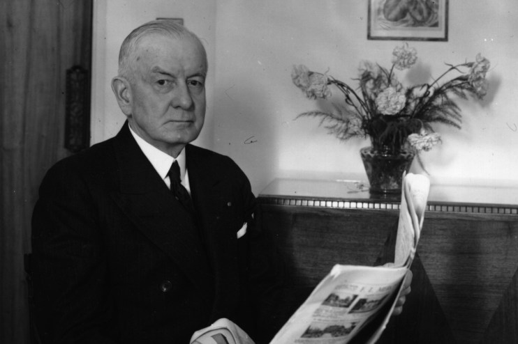 Thomas Watson, former IBM CEO, in a business setting, highlighting his leadership era at IBM in the mid-20th century.