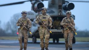 UK defence strategy meeting, officials discussing military advancements and security measures in a conference room setting