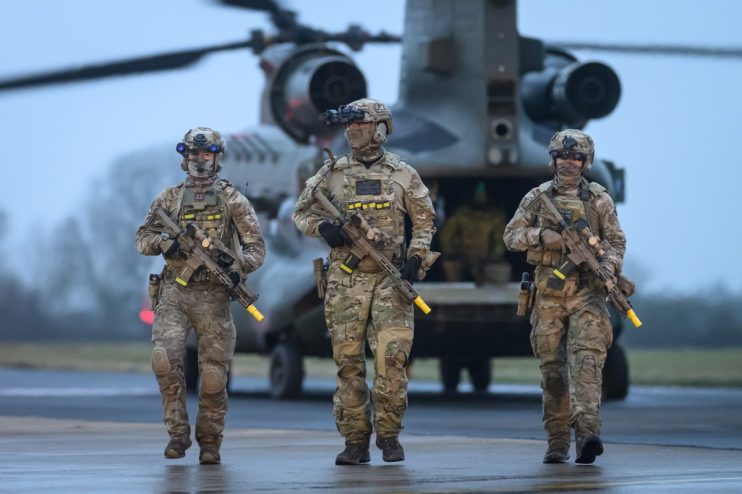 UK defence strategy meeting, officials discussing military advancements and security measures in a conference room setting