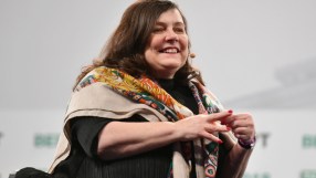 Anne Boden speaking at a business conference, highlighting financial innovations and industry leadership.