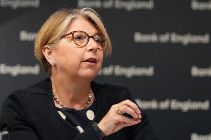 Bank of England deputy governor Breeden discusses economic policies during a press conference
