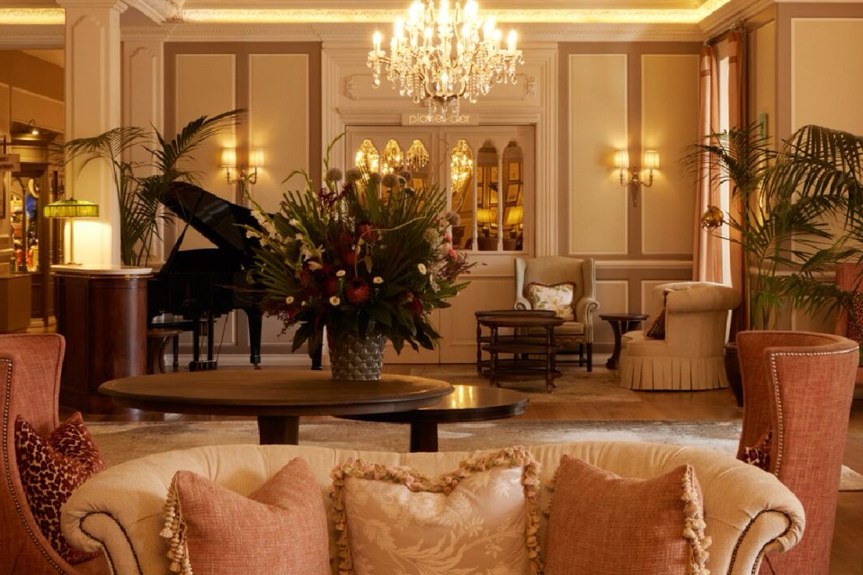 Belmonds elegant luxury train journey through picturesque landscapes, showcasing opulent interiors and scenic views