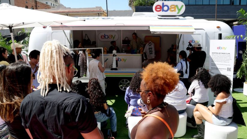 eBay logo on a sleek, modern office wall, symbolizing the companys continued impact in online marketplaces