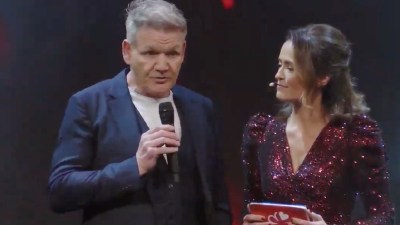 Gordon Ramsay in a kitchen setting, passionately explaining a dish preparation, showcasing his culinary expertise