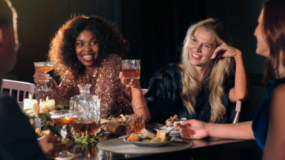 Breaking news event with people gathered, cameras flashing, and a prominent cityscape backdrop reflecting urgency and impo...