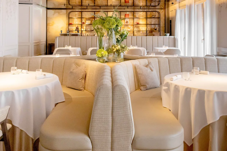 Breaking news concept with a journalist working on a laptop, surrounded by notes and coffee, in a modern office setting