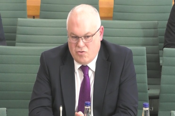 Business leader discussing innovative payment solutions in a boardroom setting, emphasizing strategic financial growth.