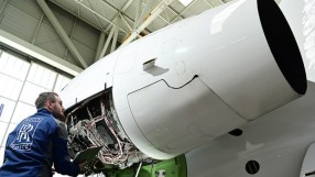 Rolls-Royce electric luxury car in elegant setting, showcasing sleek design and innovation at automotive industry event