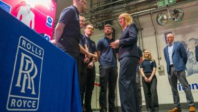 Rolls-Royce luxury car parked in an upscale urban setting, highlighting sleek design and premium craftsmanship