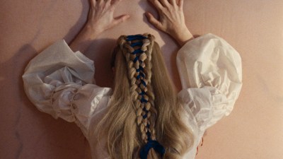 Wuthering Heights book cover featuring a windswept moor landscape with dark clouds and a solitary, weathered tree