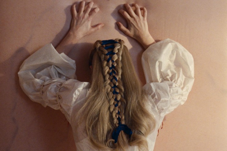 Wuthering Heights book cover featuring a windswept moor landscape with dark clouds and a solitary, weathered tree