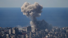 Breaking news concept with a journalist typing on a laptop, surrounded by newspapers and digital media elements
