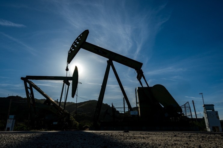 Breaking news scene with reporters, camera crews, and a large crowd gathered outside a major city courthouse building