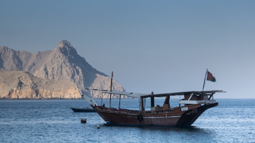 A dynamic cityscape at dusk with skyscrapers illuminated, highlighting urban growth and architectural innovation