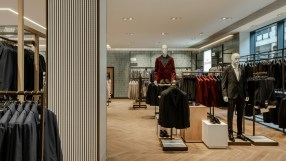 Breaking news update on major business merger showcasing executives shaking hands in a corporate boardroom setting