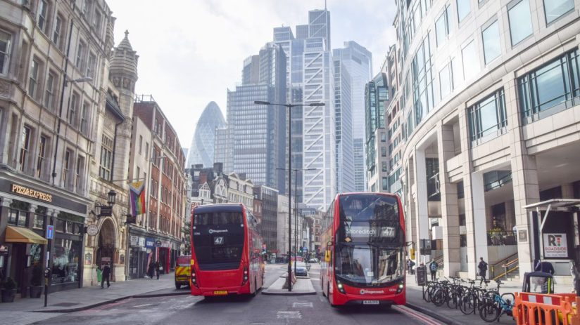 Bishopgate street view showcasing bustling city life with pedestrians, historic architecture, and modern businesses