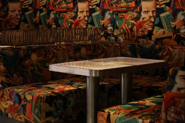 Booths showcasing innovative business solutions at a bustling industry trade show, highlighting networking opportunities a...