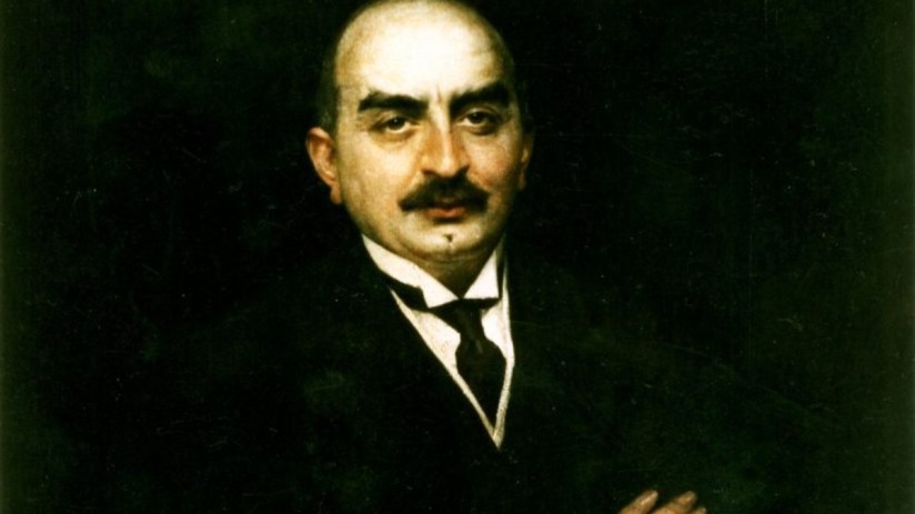 Calouste Gulbenkian portrait showcasing his influential role in business and philanthropy, wearing a formal suit and tie.