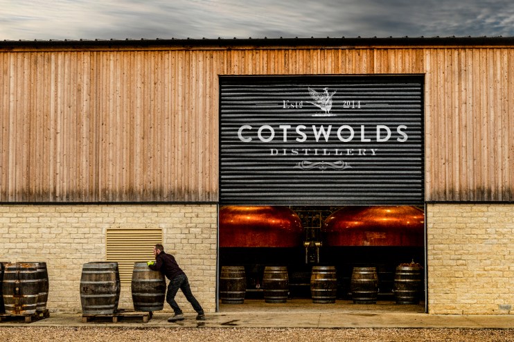 Cotswolds distillery exterior showcasing modern architecture in 2023, nestled in picturesque countryside setting