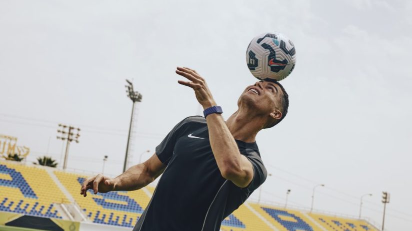 Cristiano Ronaldo celebrating a goal on the soccer field, showcasing his iconic jersey and jubilant expression during a ma...
