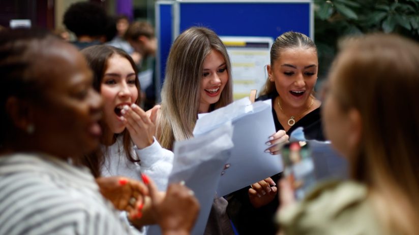 Students joyfully celebrate after receiving exam results, showcasing diverse emotions and camaraderie on campus.