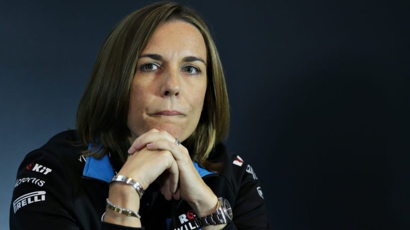 GettyImages 1172707982 shows a dynamic business meeting with diverse professionals collaborating around a conference table.