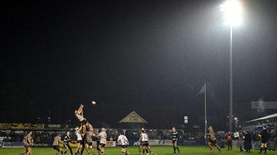GettyImages 2198238560: Business professionals collaborating in a modern office, discussing strategies and planning future...