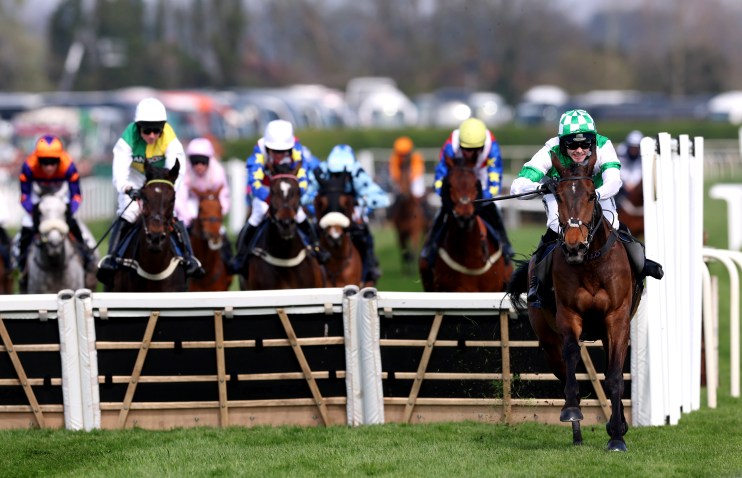 Business professionals discussing market trends in a modern conference room with charts and graphs displayed on a digital ...