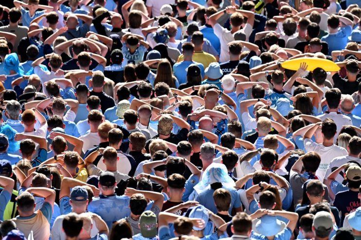 Breaking news conference podium with multiple microphones and flags in a business setting