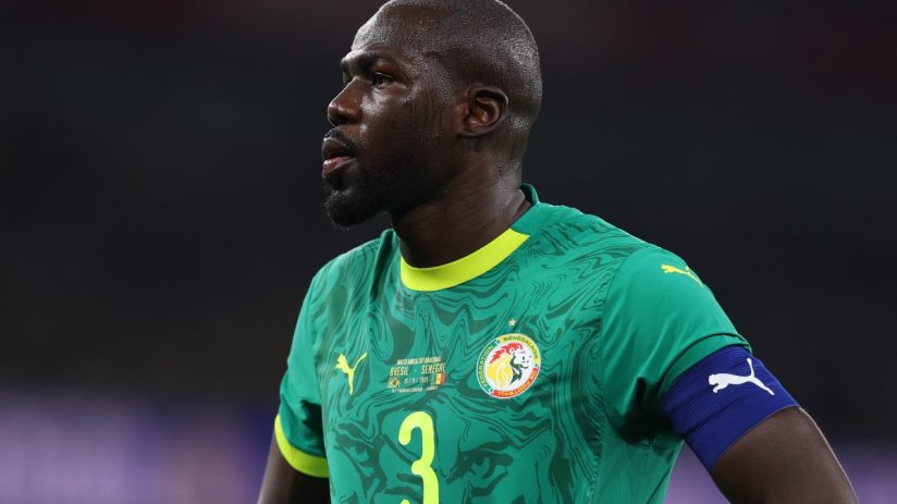 GettyImages 2246917090 featuring a dynamic business meeting with diverse professionals discussing strategic plans in a mod...