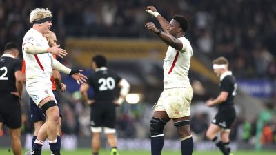 Business professionals engaged in a strategic meeting discussing financial growth and market trends in a modern office set...